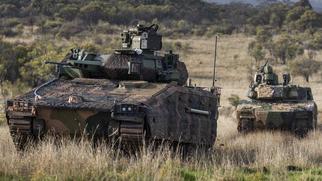 Hanwha Defence Australia Redback Infantry Fighting Vehicle (front) and Rheinmetall Defence Australia LYNX KF41 Infantry Fighting Vehicle (back), conduct LAND 400 Phase 3 user evaluation trials at Puckapunyal Military Area, Victoria.