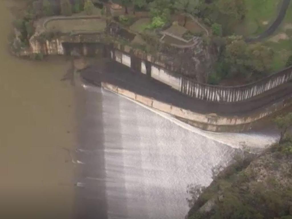 Footage shows water rushing out of the overflowing dam. Picture: ABC