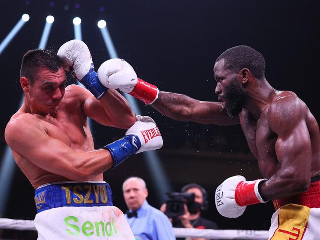 MINNEAPOLIS, MN - MARCH 26: Tim Tszyu (white with blue trunks) v Terrell Gausha (white with red and gold trunks) box in the Super Welterweight main event at the Armory on March 26, 2022 in Minneapolis, United States. Tszyu, in his USA debut defeated Gausha by judges decision.   Adam Bettcher/Getty Images/AFP == FOR NEWSPAPERS, INTERNET, TELCOS & TELEVISION USE ONLY ==