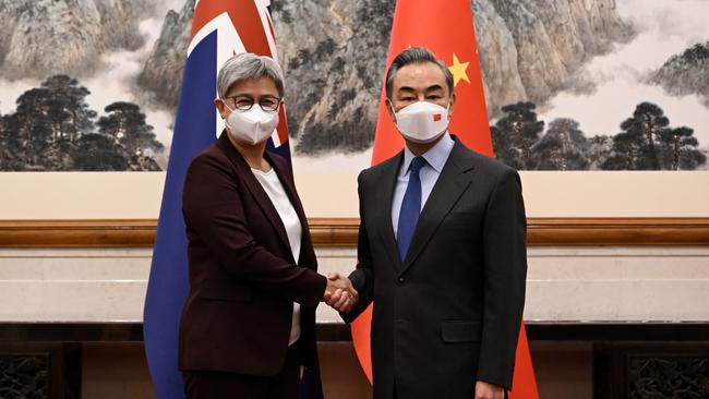 Australian Foreign Minister Penny Wong shakes hands with her Chinese counterpart, Wang Yi, on Wednesday. Picture: AAP