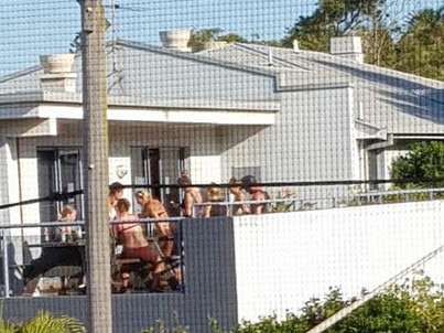 Backpacker guests gather on a terrace at the rear of the Sydney Beachouse hostel at Collaroy early last year. Picture: Supplied