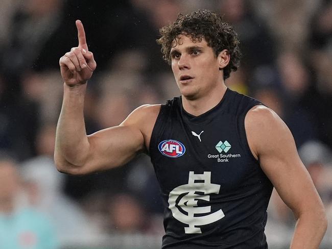 MELBOURNE, AUSTRALIA - JUNE 30: Charlie Curnow of the Blues celebrates kicking a goal during the round 16 AFL match between Richmond Tigers and Carlton Blues at Melbourne Cricket Ground, on June 30, 2024, in Melbourne, Australia. (Photo by Daniel Pockett/Getty Images)