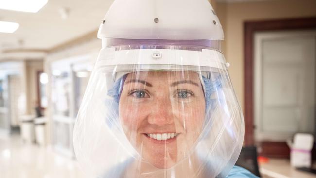 A healthcare worker wearing a Powered Air-Purifying Respirator in the intensive-care unit of Baptist Health Floyd in New Albany, Indiana. If Covid-19 evolves to overcome vaccines, it is likely to become less contagious or virulent. Picture: AFP