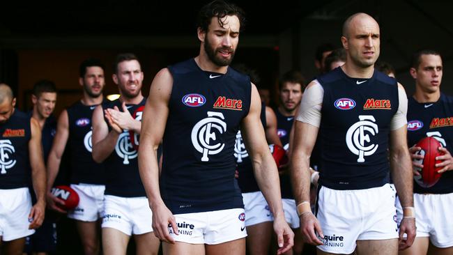 SYDNEY, AUSTRALIA - JUNE 22: Andrew Walker (L) and Chris Judd (R) of the Blues walk through the race during the round 14 AFL match between the Greater Western Sydney Giants and the Carlton Blues at Spotless Stadium on June 22, 2014 in Sydney, Australia. (Photo by Matt King/Getty Images)