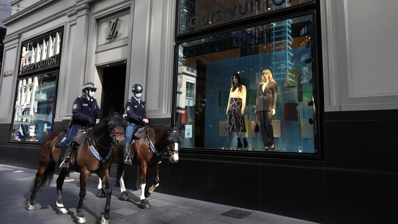 Mounted police officers patrol George Street in Sydney’s CBD. Picture: Damian Shaw