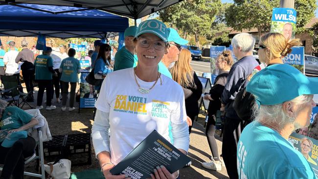 Independent MP for Goldstein Zoe Daniel hands out how-to-vote cards at a polling booth in Brighton on Friday. Picture: Zoe De Koning