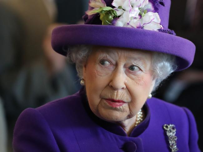 Britain's Queen Elizabeth II greets assembled guests during a visit to the International Maritime Organization (IMO) in London on March 6, 2018 to mark the 70th anniversary of its formation. As a specialized agency of the United Nations, the IMO is the global standard-setting authority for the safety, security and environmental performance of international shipping. The organisation has 173 Member States and is the only United Nations agency to be headquartered in the UK. / AFP PHOTO / POOL AND AFP PHOTO / Daniel LEAL-OLIVAS