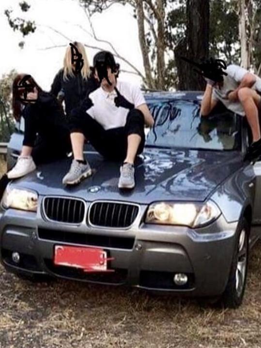 Four members of the Northside Gang on the bonnet of a luxury BMW. Picture: Instagram