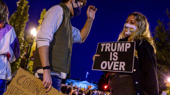 Young Democrats dance on Black Lives Matter Plaza outside the White House on Thursday. Picture: AFP