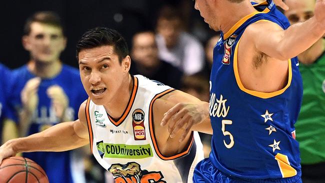 Jarrod Kenny of the Taipans (left) in action during the Round 1 NBL match between the Brisbane Bullets and Cairns Taipans at the Brisbane Convention and Exhibition Centre in Brisbane, Saturday, October 13, 2018. (AAP Image/Dan Peled) NO ARCHIVING, EDITORIAL USE ONLY