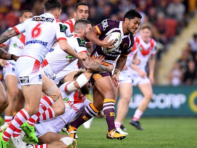 Anthony Milford of the Broncos breaks through the defence.