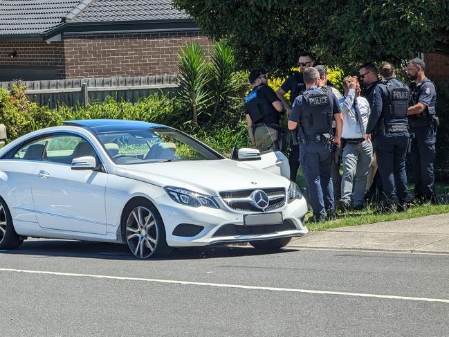 Police surround a Mercedes in Endeavour Hills on Thursday. Picture: Michael T Quaremba