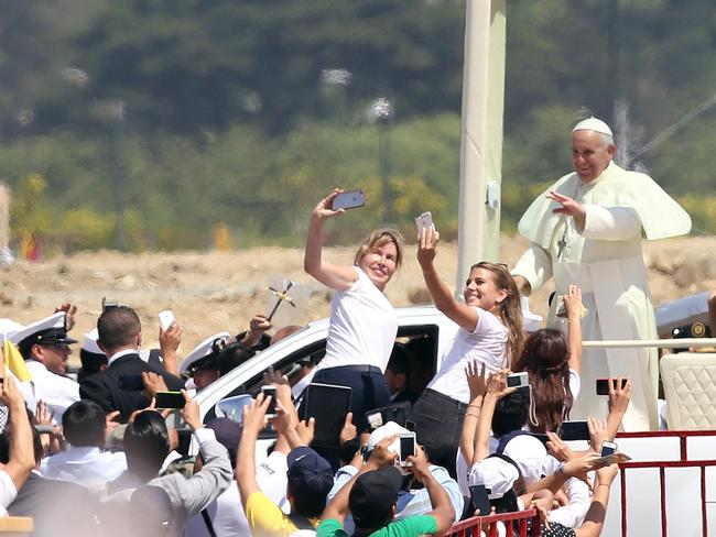 Pope Francis waves to the crowd as he rides in the popemobile through Samanes Park, in July 2015. Picture: AP