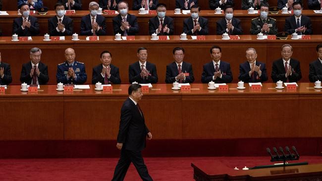 Delegates applaud Xi as he walks to the podium for his speech. Picture: Kevin Frayer/Getty Images