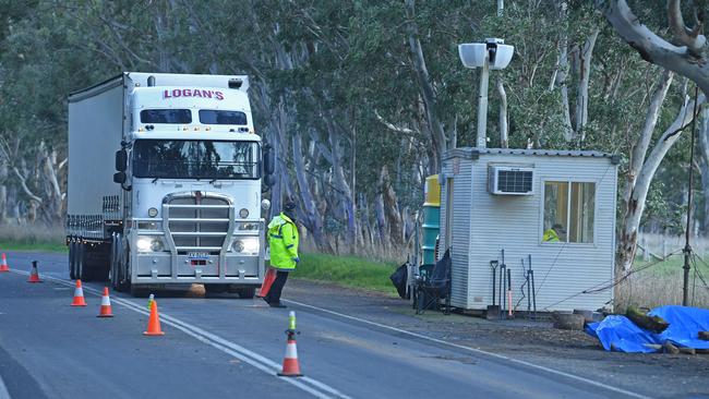 SA Police with a truck at border check point near Penola. Picture: Tom Huntley