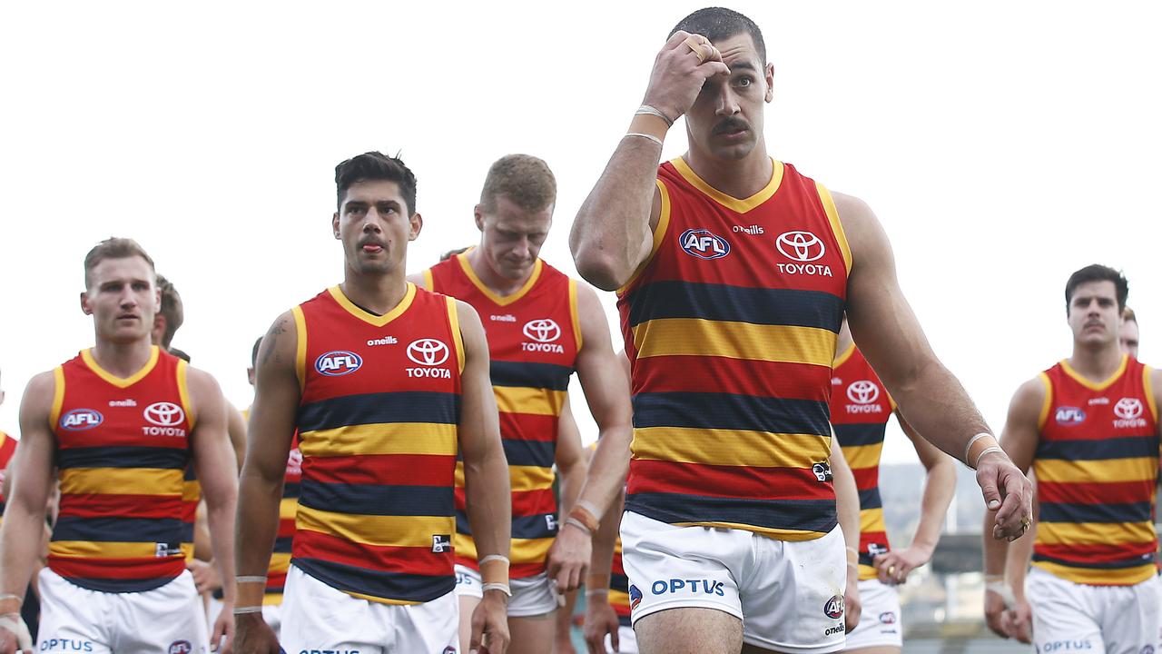 Adelaide players leave the field after the loss to Hawthorn. Picture: Getty Images