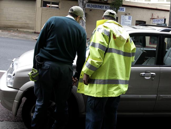 Parking rangers on Elizabeth Street in Sydney. Picture: Brad Hunter