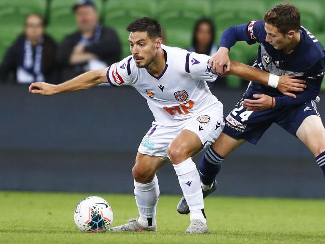 MELBOURNE, AUSTRALIA - NOVEMBER 29: Bruno Fornaroli of the Glory and Anthony Lesiotis of the Victory contest the ball during the round eight A-League match between the Melbourne Victory and the Perth Glory at AAMI Park on November 29, 2019 in Melbourne, Australia. (Photo by Daniel Pockett/Getty Images)