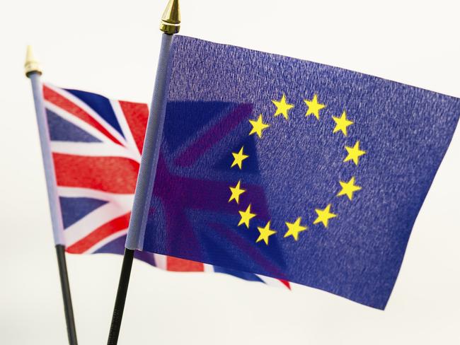 A small Union Flag of the United Kingdom, held together with a European Union flag, representing the choice in the British referendum on EU membership, to be held on 23rd June 2016, characterised as the 'Brexit' referendum.