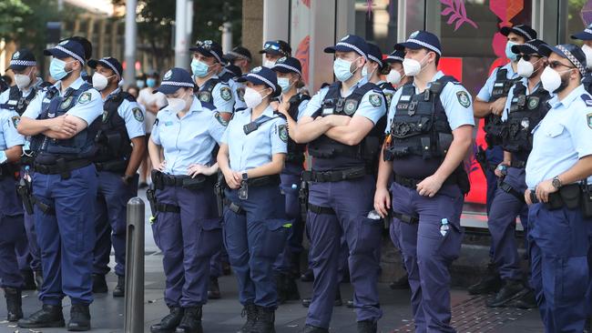 Police officers monitor the protest at Town Hall. Picture: John Grainger