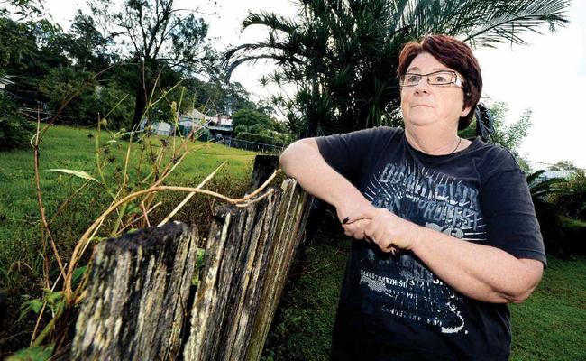 BAD IDEA: Judi Lindsay of East Lismore, pictured at her back fence overlooking parkland, is concerned about the Lismore City Council plans to sell small parks. Picture: Cathy Adams