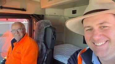 Truck veteran Ron Finemore (left) in the cabin with Regional Roads Minister Sam Farraway (right). Picture: Supplied