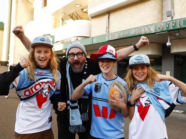 DAILY TELEGRAPH SEPTEMBER 20, 2024. Sharks and Swans fans Luke Shanahan with his sons Rudy, 13, (left) and Walt, 11, (right) and their friend Max Munce, 12, at Moore Park for the Sharks Vs Cowboys NRL Finals game. Picture: Jonathan Ng