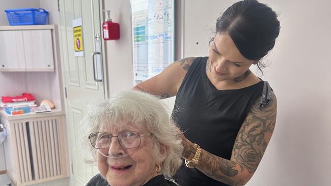 Mater Private Hospital Rockhampton patient Heather Orr receives a trim from Thieves and Beggars hairdresser Kara Morgan.