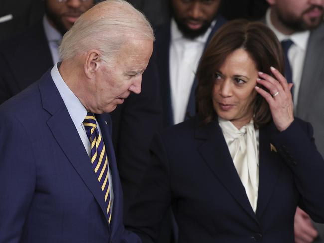 WASHINGTON, DC - JANUARY 17: U.S. President Joe Biden holds hands with Vice President Kamala Harris (R) during a ceremony honoring the Golden State Warriors on January 17, 2023 in Washington, DC. The Warriors won the 2022 NBA Championship. (Photo by Win McNamee/Getty Images)