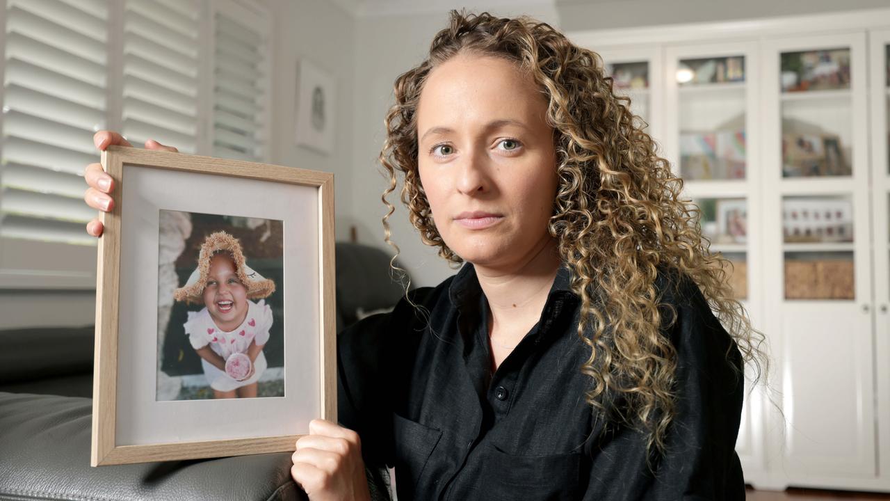 Hannah Pringle with a photo of her daughter Ruby Pringle, who died from an aggressive brain tumour DIPG at the age of six in 2023. Picture: Steve Pohlner