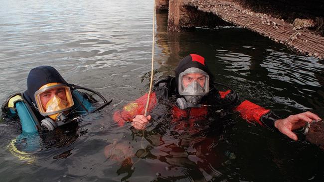 Police divers search the Port River for Daniel Sheppard. Picture: Campbell Brodie