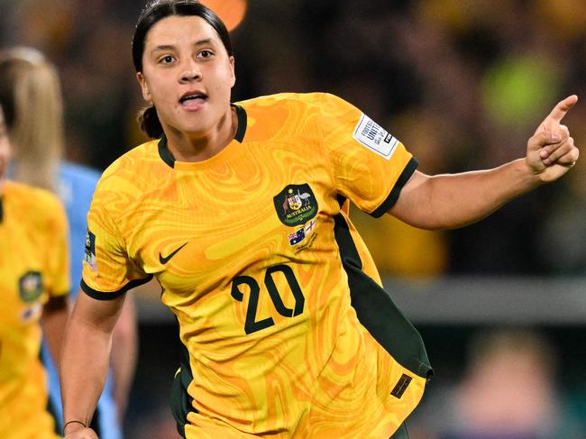FILES-- This file photo taken on August 16, 2023 shows Australia's forward Sam Kerr celebrating scoring her team's first goal during the Australia and New Zealand 2023 Women's World Cup semi-final football match between Australia and England at Stadium Australia in Sydney. Chelsea and Australian women's football star Sam Kerr has been charged with a "racially aggravated offence" in Britain following a dispute involving a police officer, London's Metropolitan Police said March 4. The 30-year-old striker, one of the highest profile and best-paid players in the women's game, was charged following an incident in London in January 2023, a police statement read. (Photo by IZHAR KHAN / AFP)