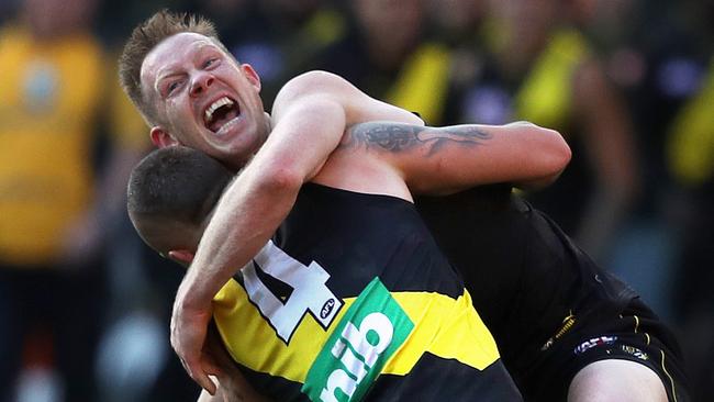 RichmondÕs Jack Riewoldt celebrates victory on the final siren with Dustin Martin as a dejected Heath Shaw looks on during the AFL Grand Final between the GWS Giants and Richmond Tigers at the MCG on September 28, 2019 in Melbourne. Picture. Phil Hillyard