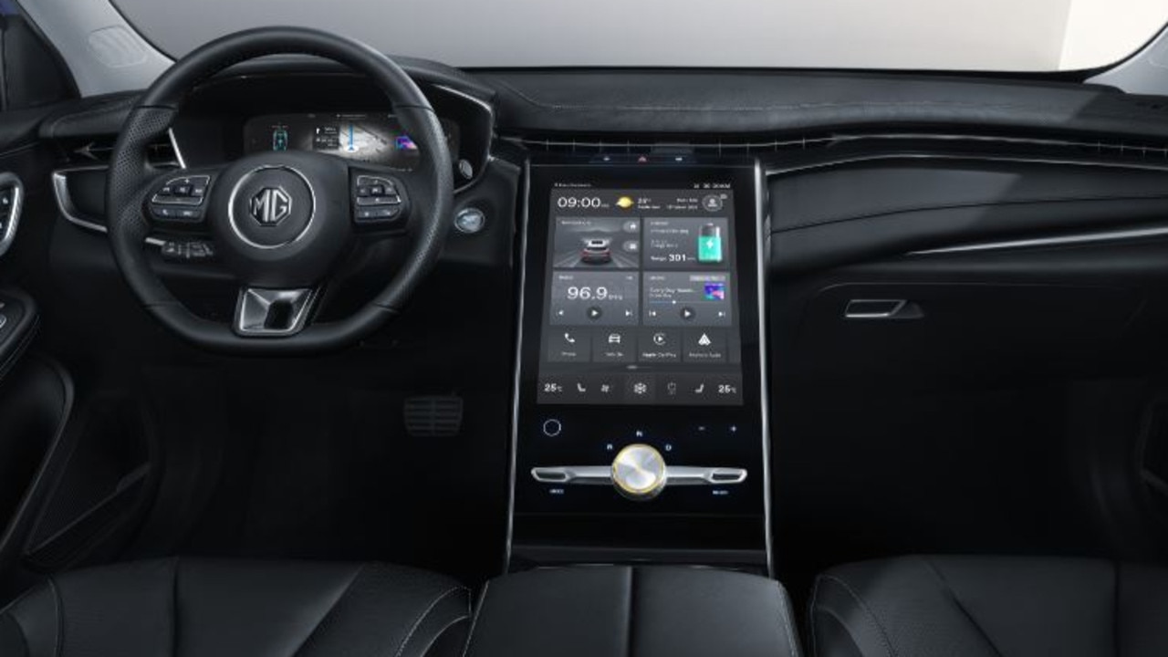 The interior is dominated by a massive 19-inch tablet style screen.