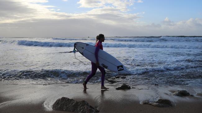 The 2019 Rip Curl Pro Surfing at Bells Beach Victoria. Australia's Stephanie Gilmore enters the water. Picture: Alex Coppel