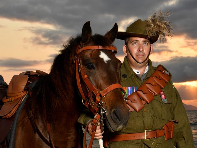 Veteran and 27th Light Horse Regiment Incorporated president Jason Mengel at Rowes Bay at dawn with Soks is set for Remembrance Day. Picture: Evan Morgan