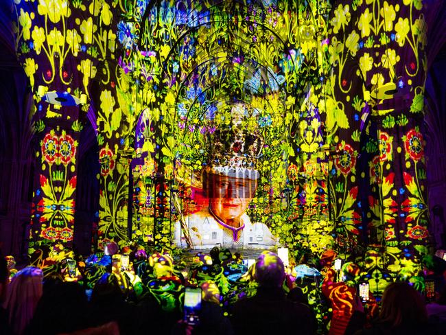 Visitors at Exeter Cathedral stand mesmerised by a projection of King Charles III, part of a touring art installation across the UK. Picture: Finnbarr Webster/Getty Images