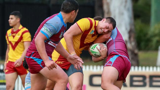 Holy Cross, Edwyne Afeaki makes some metres up the middle. Picture:Justin Lloyd