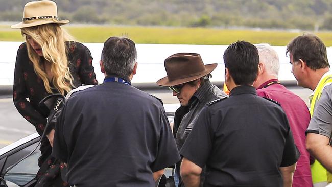 Amber Heard and Johnny Depp on the tarmac at Gold Coast Airport. The couple are returning home to the US on a private charter flight. Photo: ©MEDIA-MODE.COM