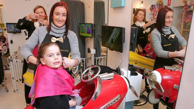 Carlo &amp; Elise hairdresser Bryony Buffery tends to Poppy Pope, 3 in the new Mosman salon. Picture: Adam Ward