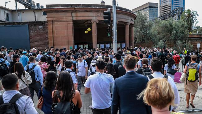 Commuters wait outside Central Station on March 8 after a communication issue saw the entire train network shut down. Picture: Roni Bintang