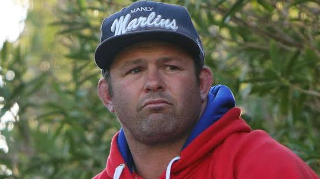 Damien Cumnins watches the Manly Marlins play at Manly Oval. Picture: Karen Watson.