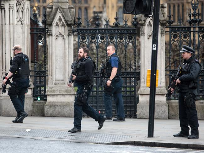Armed officers on the scene outside Parliament. Picture: Jack Taylor/Getty Images