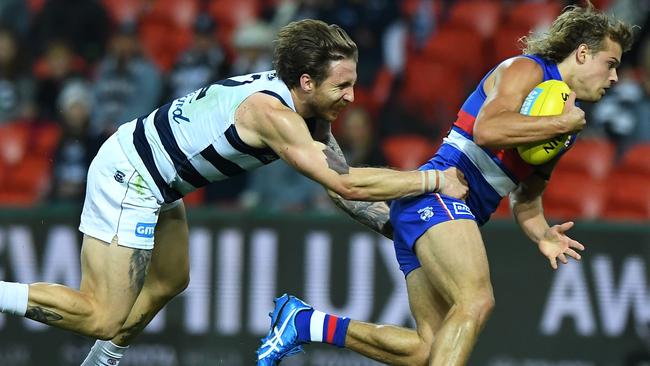 Zach Tuohy tackles Bailey Smith before going off after a heavy hit on Friday night