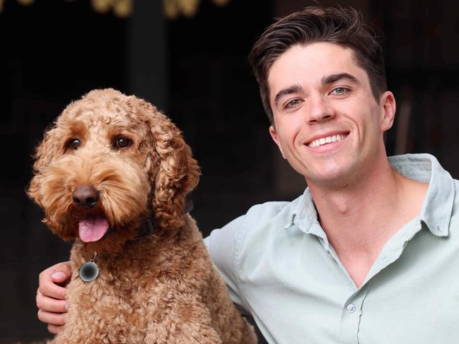 ADV SSSMax Burford, the media young gun who's claimed two of the best jobs in SA media? Portrait at Loveon Cafe, Mile End with his dog Morris.IMAGE/Russell Millard