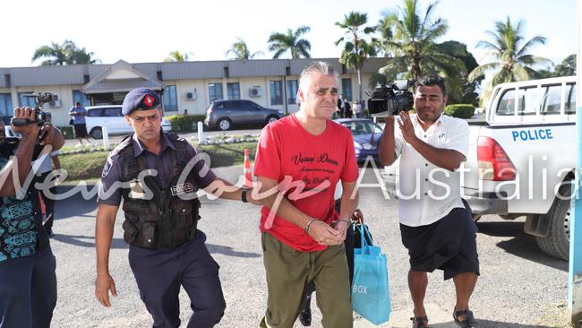 John Nikolic being escorted to the Magistrates Court in Nadi. Picture: Gary Ramage