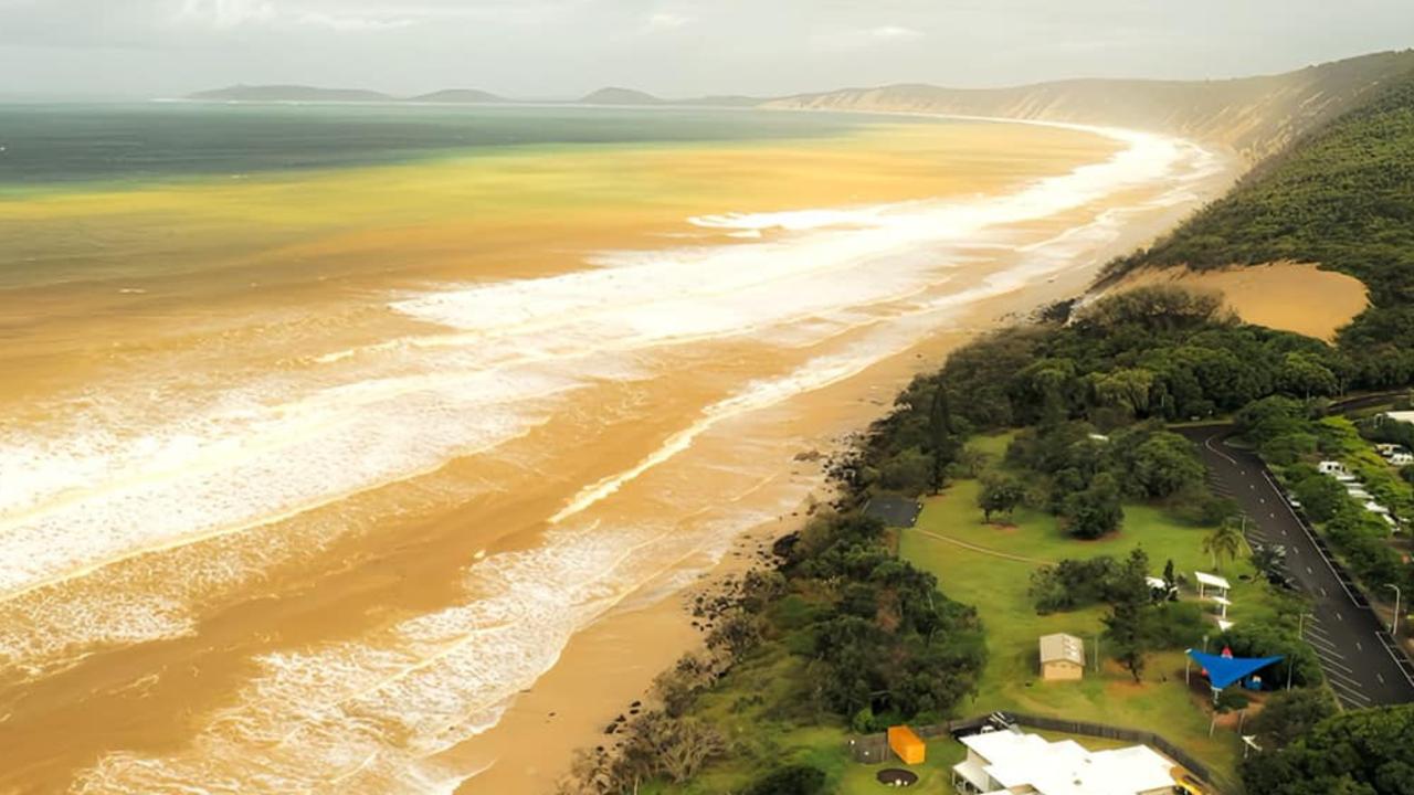 Watch: Cyclone strips Rainbow Beach as 17m wave recorded off K’gari