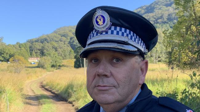 Chief Inspector Anthony Moodie at the scene on Tuesday morning, June 20. The home where the 78-year-old died is obscured behind the first ridge line of trees and the brown shed where his 50-year-old son lives can be seen to the left. Picture: Janine Watson