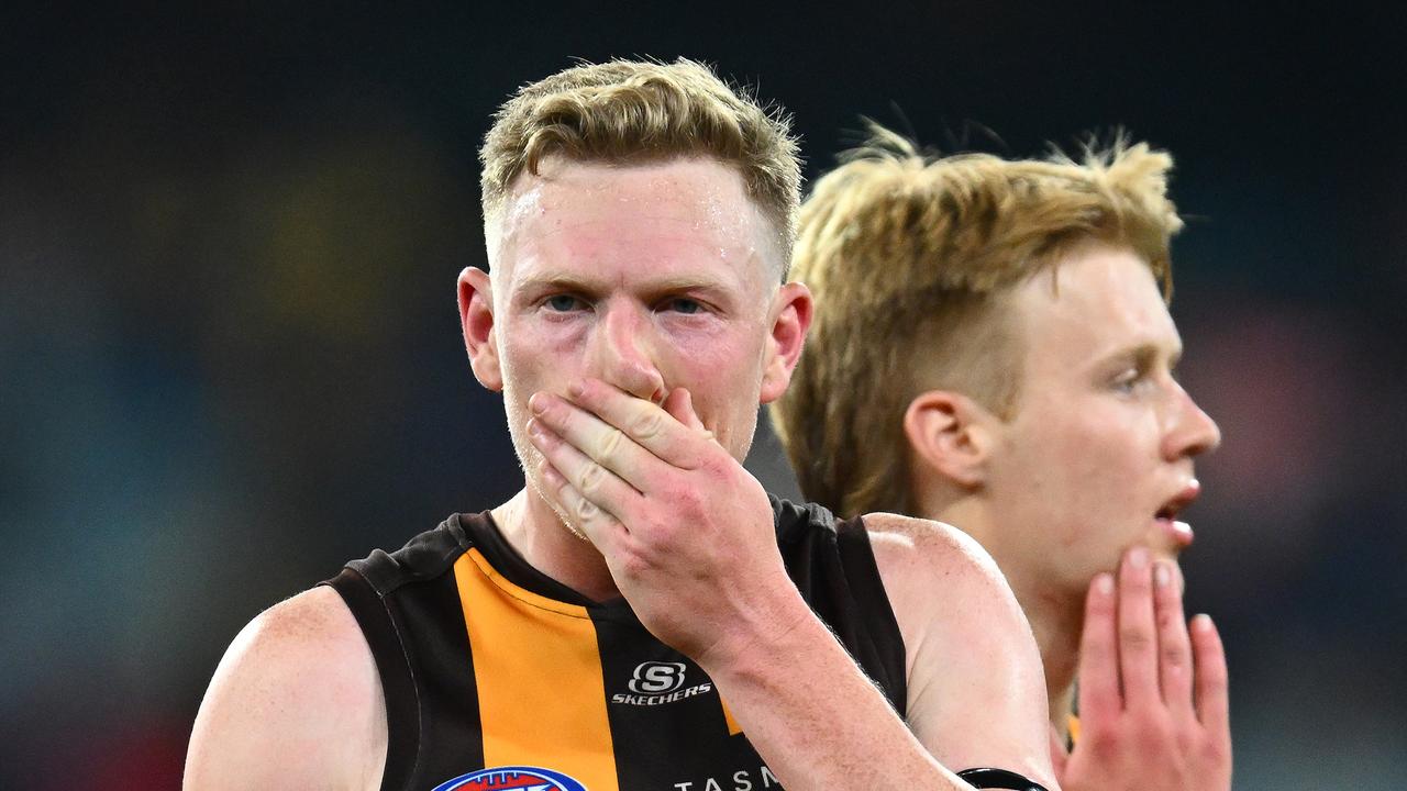 MELBOURNE, AUSTRALIA - MAY 13: James Sicily and Cam Mackenzie of the Hawks look dejected after losing the round nine AFL match between Hawthorn Hawks and Melbourne Demons at Melbourne Cricket Ground, on May 13, 2023, in Melbourne, Australia. (Photo by Quinn Rooney/Getty Images)