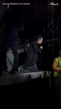 Matty Healy kisses a security guard